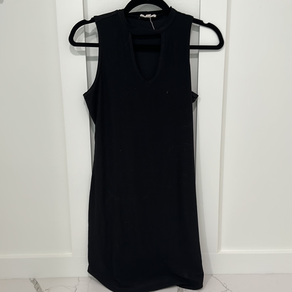 Form fitting dress. Unique neck line